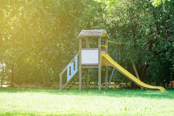 Empty playground on yard in the park — Stock Photo, Image