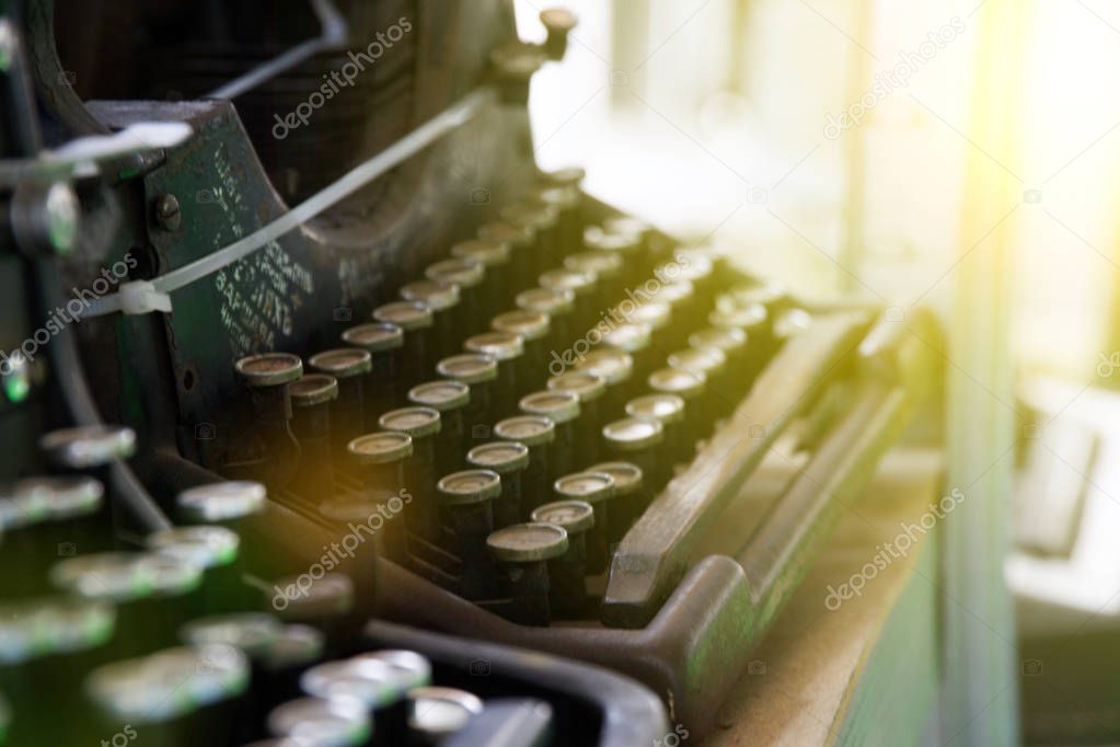 Old typewriter in antique photography vintage simulated, grunge photo