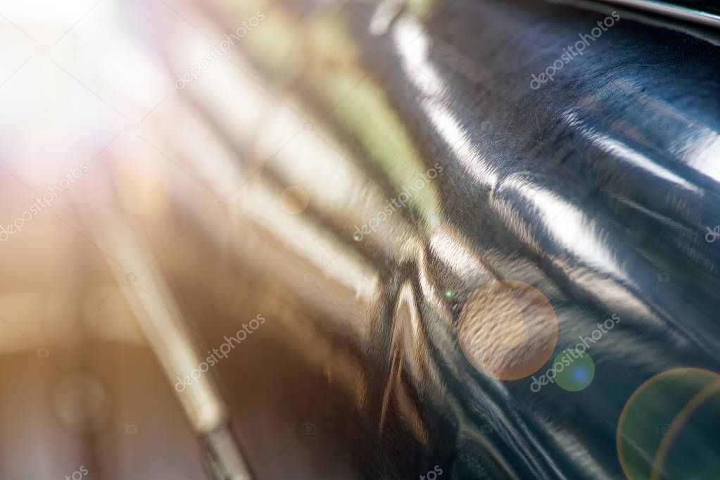Polished car body with light reflection, sunny bunny on old vintage car, business consept