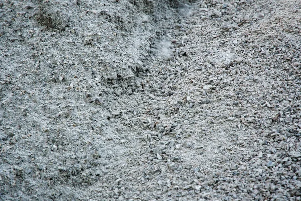 Kavics, homok és gránit kavics textúra. Zúzott kavics háttérben. Rakás kövek textúra. Ipari parazsat — Stock Fotó