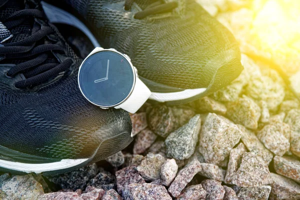 Sport watch for crossfit and triathlon on the running shoes. Smart watch for tracking daily activity and strength training. Sun beam lights.