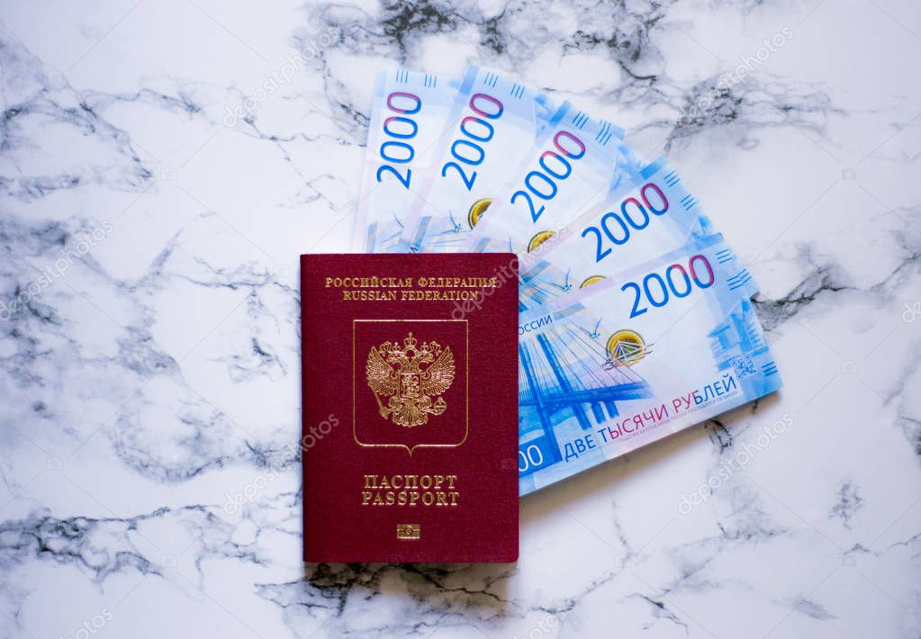 russian passport and russian money on marbel background
