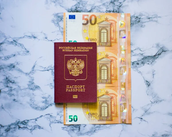 stock image Russian passport with euro on marbel background