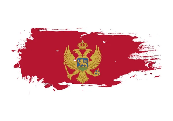 Grunge Pinselstrich mit montenegrinischer Nationalflagge. Aquarell pa — Stockvektor