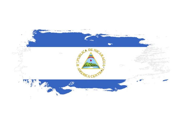 Grunge coup de pinceau avec le drapeau national du Nicaragua. Aquarelle pai — Image vectorielle