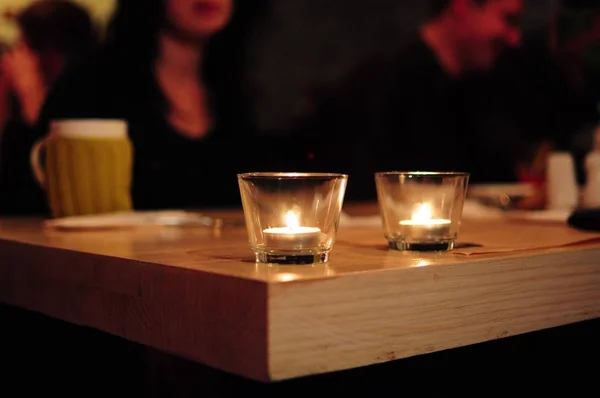 Candles in glasses in cafe