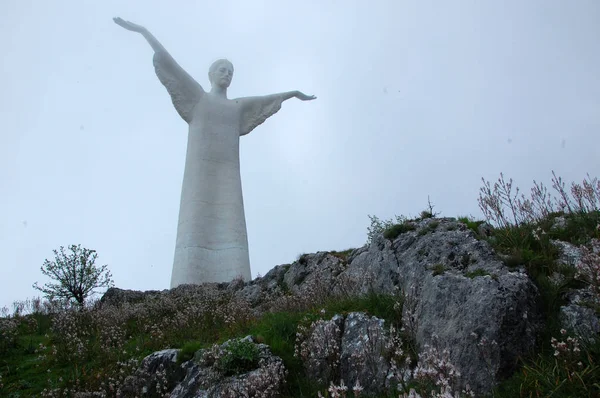 The Statue of Christ the Redeemer of Maratea on the top of the Mountain Saint Biagio. Day.