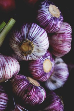 close up of violet garlic at georgian market clipart