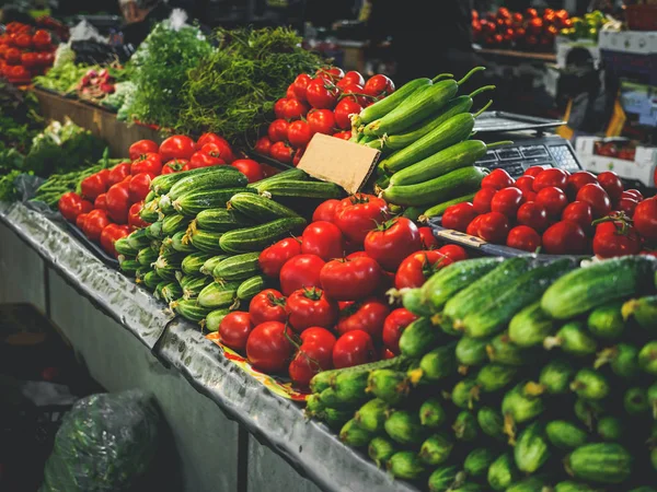 Ripe tomatoes and cucumbers at georgian market — Stock Photo