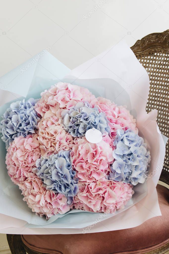 beautiful spring bouquet with tender pink and blue flowers
