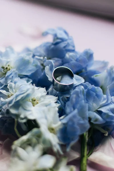 beautiful spring bouquet with tender blue flowers and ring