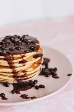 stack of delicious homemade pancakes with sauce clipart