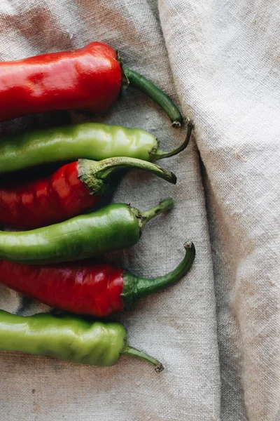 pile of fresh red and green chili peppers