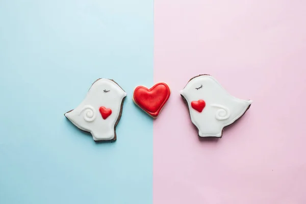 two cookies in heart shape two doves with glaze