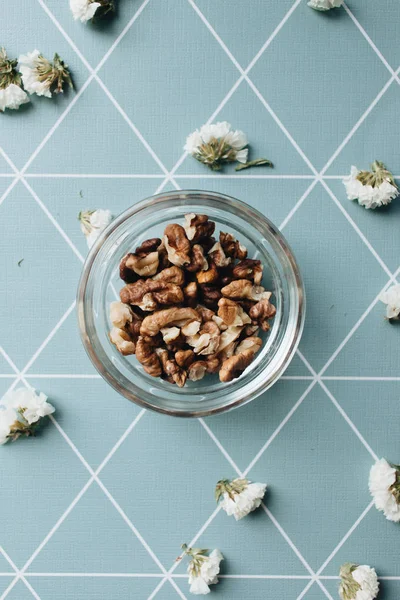 stock image pile of shelled walnuts in glass bowl, healthy eating concept