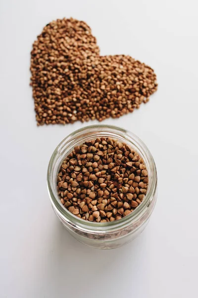 Raw Buckwheat White Background Shaped Heart Symbol — Stock Photo, Image