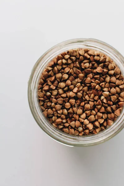 Jar Raw Buckwheat White Background — Stock Photo, Image