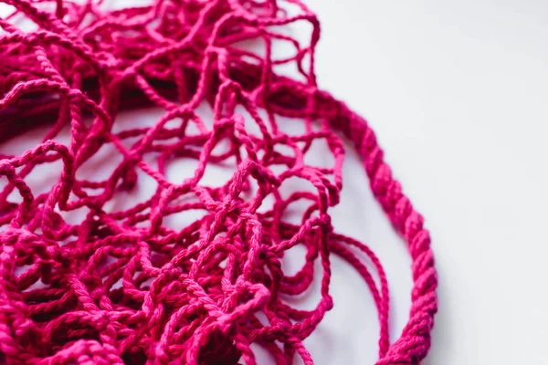 pink string bag background, net pattern