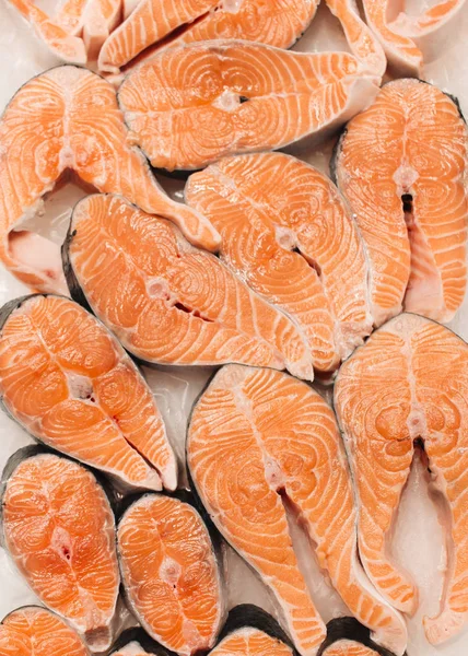 raw salmon steaks, food background