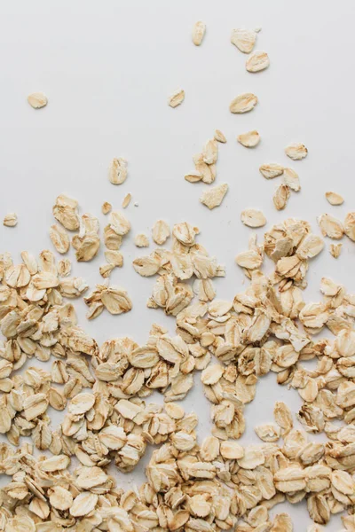 Scatterd Raw Oat Flakes White Background — Stock Photo, Image