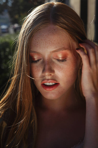 Portrait of Redhead girl with freckles
