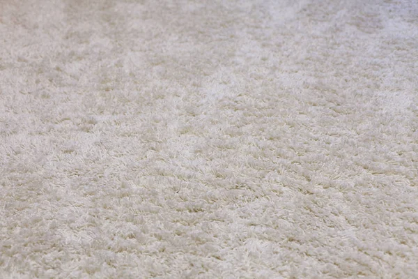fluffy white carpet in the apartment