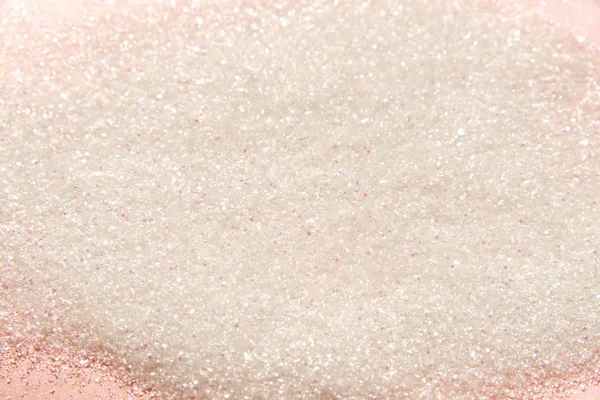 Classic shiny pastel pink glitter background with selective focus - glitter powder - abstract