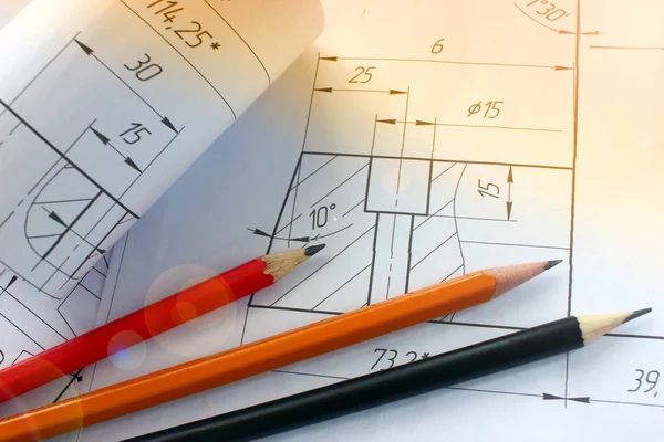 Open drawings with a pencil. Engineering and design. Construction projects. Planning.
