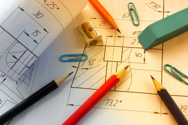 Open drawings with a pencil. Engineering and design. Construction projects. Planning.