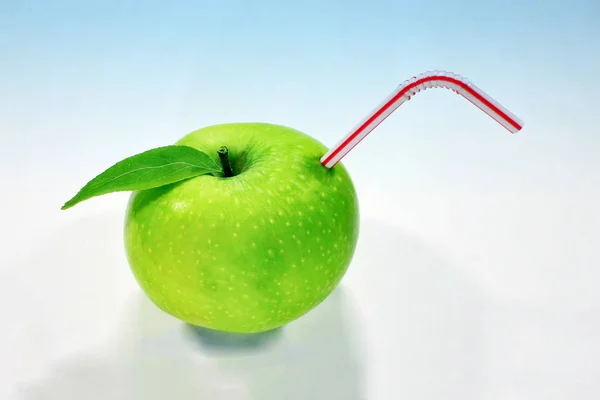 green apple on a white background like a glass of juice, drink vitamins, toned