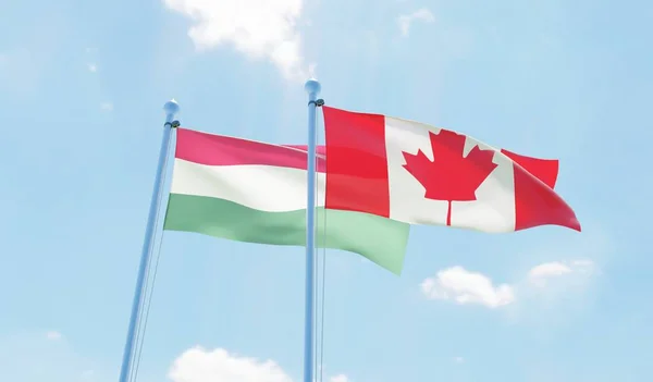 Canadá Hungria Duas Bandeiras Acenando Contra Céu Azul Imagem — Fotografia de Stock