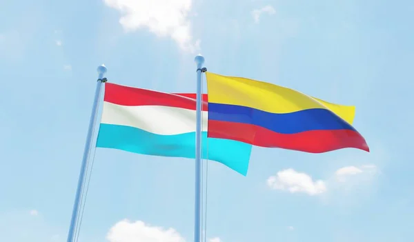 Colombia Luxemburgo Dos Banderas Ondeando Contra Cielo Azul Imagen — Foto de Stock