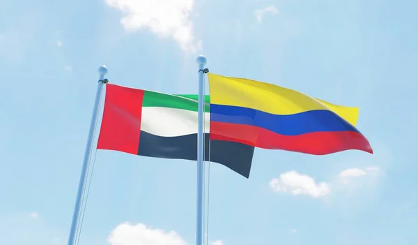 Kolumbia Zjednoczone Emiraty Arabskie Dwie Flagi Macha Przeciw Błękitne Niebo — Zdjęcie stockowe