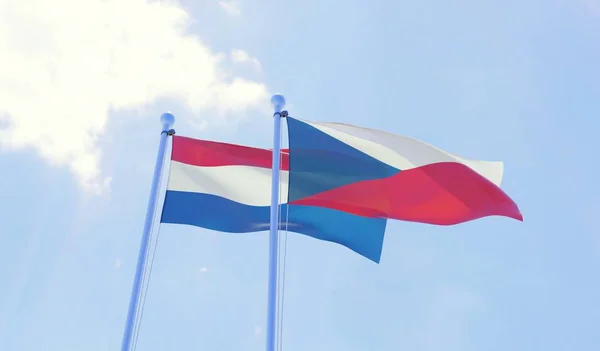 stock image Czech Republic and Netherlands, two flags waving against blue sky. 3d image