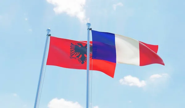 Francia Albania Dos Banderas Ondeando Contra Cielo Azul Imagen —  Fotos de Stock