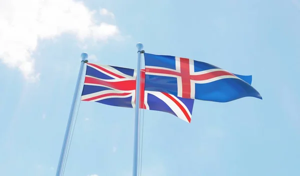 Reino Unido Islandia Dos Banderas Ondeando Contra Cielo Azul Imagen — Foto de Stock