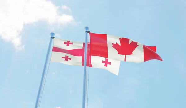 Georgië Canada Twee Vlaggen Zwaaien Tegen Blauwe Hemel Afbeelding — Stockfoto