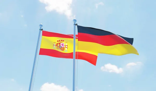 Almanya ve İspanya, iki bayrak sallayarak karşı mavi gökyüzü. 3D görüntü