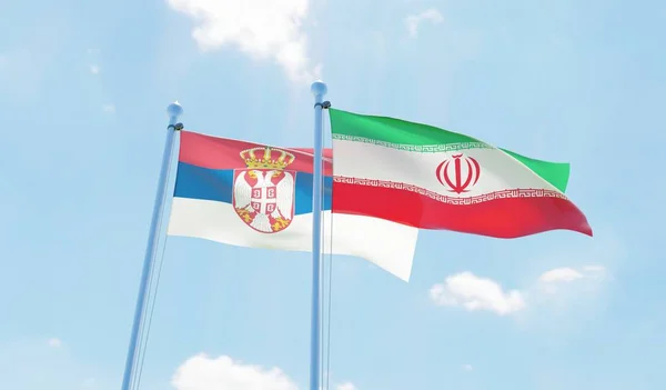 Iran Servië Twee Vlaggen Zwaaien Tegen Blauwe Hemel Afbeelding — Stockfoto