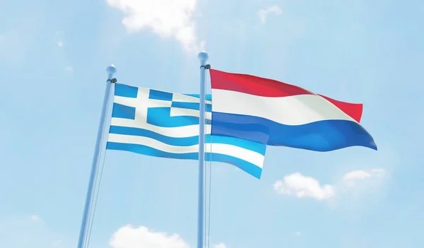 Países Bajos Grecia Dos Banderas Ondeando Contra Cielo Azul Imagen —  Fotos de Stock