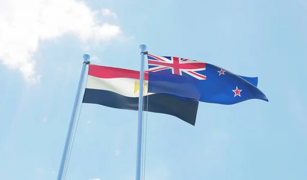 新西兰和埃及两旗飘扬在蓝天上 — 图库照片