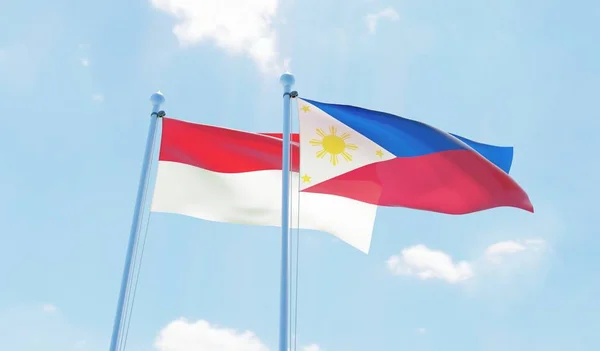Filippinerna Och Indonesien Två Flaggor Vajande Mot Blå Himmel Bild — Stockfoto