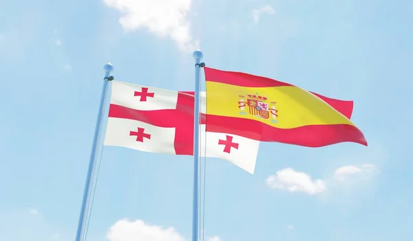 Hiszpania Gruzji Dwie Flagi Macha Przeciw Błękitne Niebo Obraz — Zdjęcie stockowe