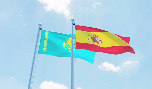 西班牙和哈萨克斯坦 两旗飘扬在蓝天上 — 图库照片