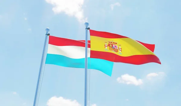 Hiszpania Luksemburg Dwie Flagi Macha Przeciw Błękitne Niebo Obraz — Zdjęcie stockowe