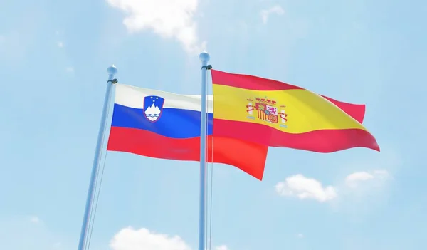 Hiszpania Słowenia Dwie Flagi Macha Przeciw Błękitne Niebo Obraz — Zdjęcie stockowe