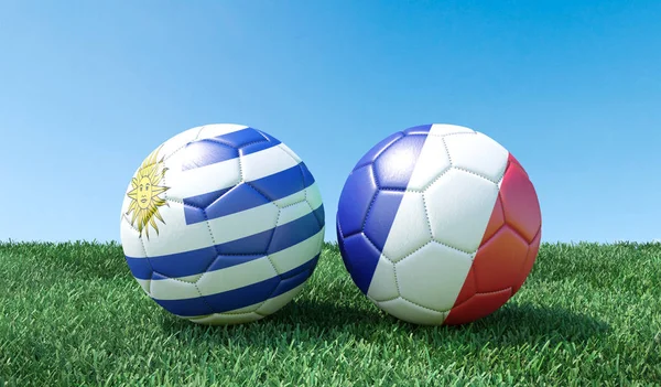 Two soccer balls in flags colours on green grass. Uruguay and France. 3d image