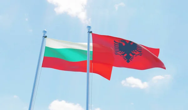 Albania Bulgaria Dos Banderas Ondeando Contra Cielo Azul Imagen —  Fotos de Stock