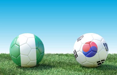 Bayrak renkleri yeşil çimenlerin üzerinde iki futbol topları. Türkiye ve Güney Kore. 3D görüntü
