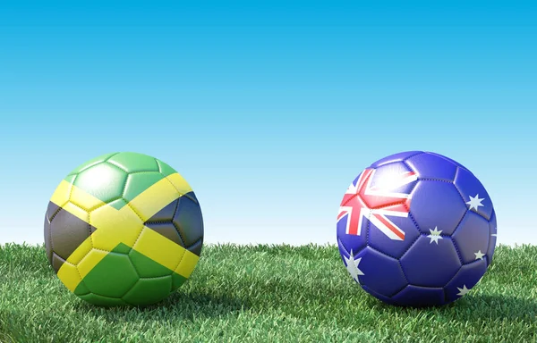 Два Футбольных Мяча Цветах Флагов Зеленой Траве Ямайка Австралия Изображение — стоковое фото